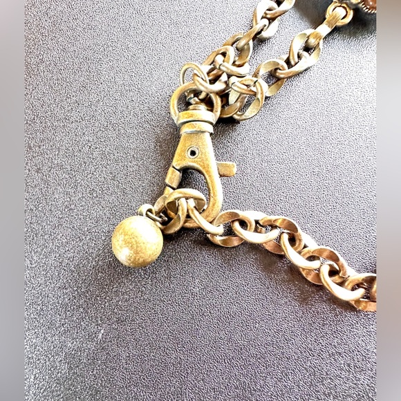 Brass tone flower belt with brown rims tones. Lobster clasp closure. - Picture 6 of 6